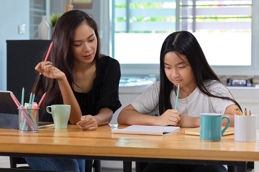 student and tutor together at a desk in Akron